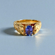 Load image into Gallery viewer, Scalloped Hibiscus 6mm Tapered French Mount Solitaire Ring with Oval Tanzanite in 14K Yellow Gold in size 6 3/4