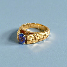 Load image into Gallery viewer, Scalloped Hibiscus 6mm Tapered French Mount Solitaire Ring with Oval Tanzanite in 14K Yellow Gold in size 6 3/4
