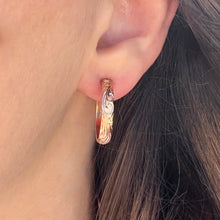 Load image into Gallery viewer, Model wearing 4mm Old English Medium Hoop Earrings with Post in 14K Pink Gold