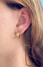 Load image into Gallery viewer, Model wearing Scalloped 6mm Old English Hoop Earrings in 14K Yellow Gold