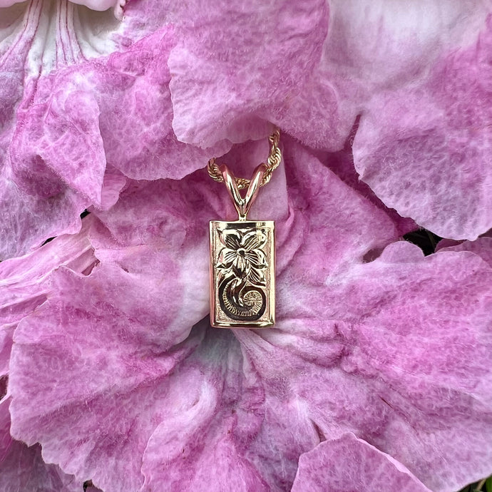 Hawaiian Jewelry pendant with engraved flower