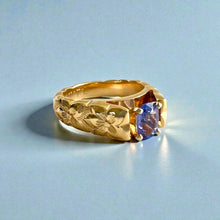 Load image into Gallery viewer, Scalloped Hibiscus 6mm Tapered French Mount Solitaire Ring with Oval Tanzanite in 14K Yellow Gold in size 6 3/4
