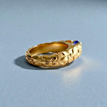 Load image into Gallery viewer, Scalloped Hibiscus 6mm Tapered French Mount Solitaire Ring with Oval Tanzanite in 14K Yellow Gold in size 6 3/4
