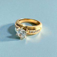 Load image into Gallery viewer, Kaimana Tapered 6mm Plumeria with Leaves Ring with 6.4mm Cubic Zirconia &amp; Diamonds in 14K Yellow Gold in size 6 1/2
