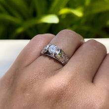 Load image into Gallery viewer, Model wearing Old English &amp; Hibiscus 6mm French Mount Solitaire Ring in .75ct Cubic Zirconia in 14K White Gold in size 6 5/8
