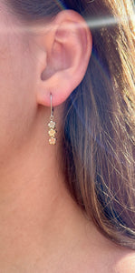 Model wearing Tri-Color Three Baby Plumeria Flowers Lever Back Earrings in 14K Gold