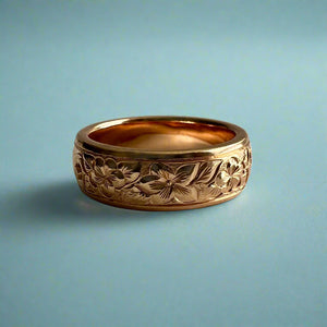 Ring size 5 3/4. Old English with 3 Flowers in a row (Hib/Plum/Hib). Plain border.