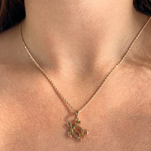 Load image into Gallery viewer, Model wearing Petroglyph Turtle Pendant
