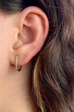 Load image into Gallery viewer, Girl wearing Oval Diamond Hoop Earrings in 18K Yellow Gold
