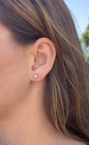 Model wearing Stud Earrings with Heart Shaped Diamonds in 14K White Gold