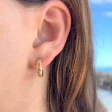 Load image into Gallery viewer, model wearing Old English &amp; Hibiscus Round Hoop 4mm Earrings with Post in 14K Yellow Gold
