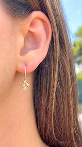 Model wearing Small Quilt Earrings in 14K Green Gold