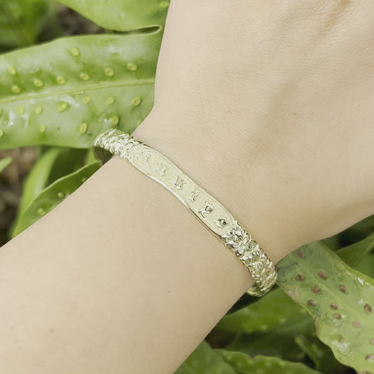 Hawaiian Bracelet in green gold shown on hand