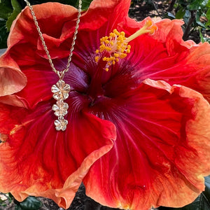 Hibiscus flowers pendant in gold